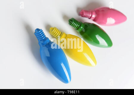 Painted light bulbs on white background Stock Photo