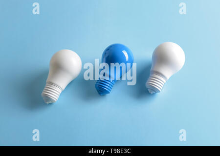 Painted light bulbs on color background Stock Photo