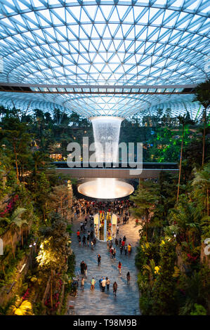 28.04.2019, Singapore, , Singapore - View into the new Jewel Terminal with waterfall and Forest Valley at the international airport Changi. The design Stock Photo
