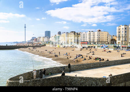 A view of Brighton beach and seafront hotels on the promenade as seen from Palace Pier, Brighton and Hove, East Sussex, England, UK Stock Photo