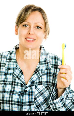 Blonde woman brushing teeth, cleaning - everyday's routine activity - white background Stock Photo