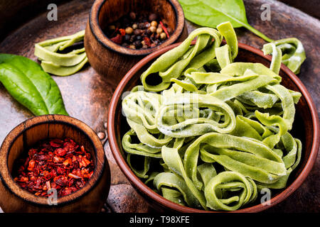 Spinach noodles.Handmade noodles and ingredients.Fresh uncooked noodles Stock Photo