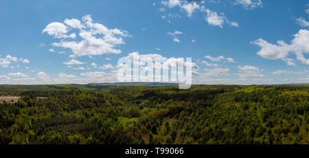 A landscape with mountains and blue sky with white clouds, at Pocono Mountains, New York, USA. Stock Photo