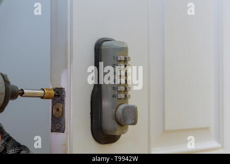 Electronic door handle installed on wood door with digital door lock systems security protection for apartment. Stock Photo