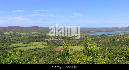 Panoramic view across lush green rural countryside, hills and lakes near Valle de Picadura, Mayabeque Province, Cuba Stock Photo