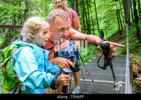 Family watching the impressive cascade of the Dietersbach in Allgäu on artificial viewing platform Stock Photo