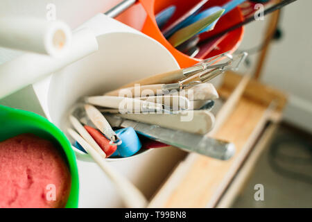 pottery tools for carving ceramic products in workshop Stock Photo