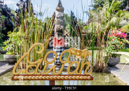 Sign at Pura Goa Lawah ('Bat Cave Temple'), Balinese Hindu temple in Pesinggahan, Klungkung, Bali, Indonesia. Stock Photo