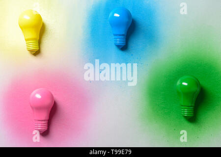 Painted light bulbs on light background Stock Photo