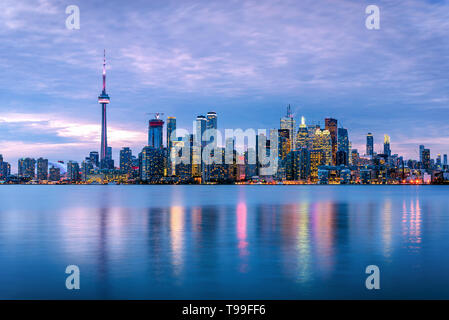 Majestic view of Toronto skyline and waterfront from Toronto Islands at dusk in autumn. Ontario, Canada. Stock Photo