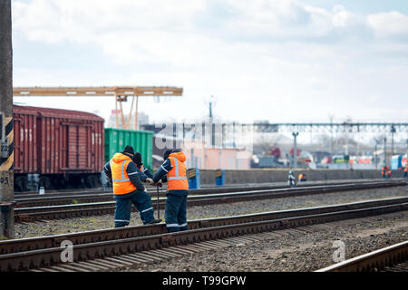 Employees of railway depot inspect repair and maintenance of railway rails in order to detect breakdowns and ensure safety of trains on railway moveme Stock Photo