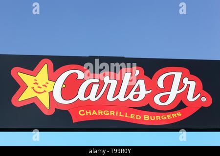 Tilst, Denmark - April 19, 2019: Carl's jr logo on a panel. Carl's jr is an American fast food restaurant chain operated by CKE Restaurant Holdings Stock Photo