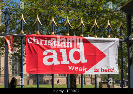 Christian Aid Week banner on railings by St Phillips Cathedral in Birmingham, UK Stock Photo