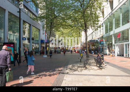 Shoppers in the pedestrianised New Street in Birmingham city centre Stock Photo