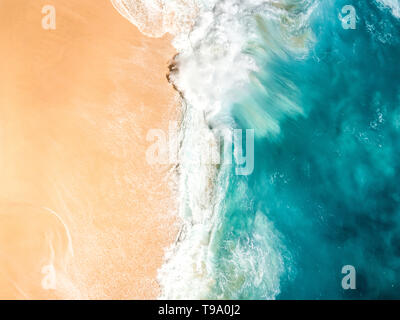Aerial picture of wave breaking with violence in a tropical beach Stock Photo