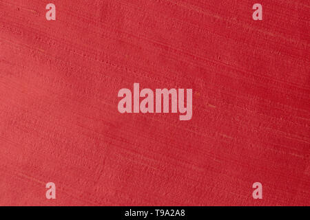 Close up of a woolen fabric of red violet color. Abstract canvas background, empty template. Stock Photo