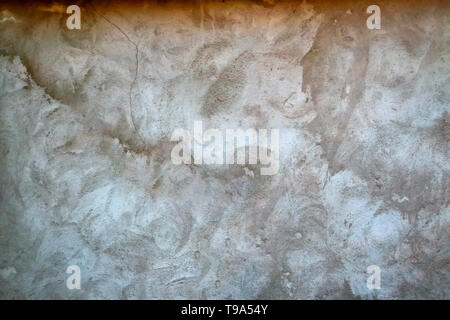 Texture of the old wall with peeling paint, plaster with cracks. Stock Photo