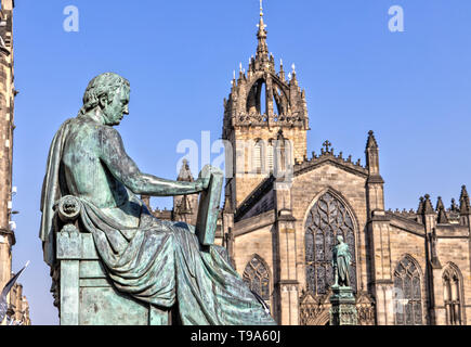 David Hume Statue and St Giles Cathedral in Edinburgh , Scotland Stock Photo