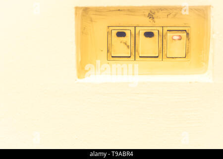old vintage electrical switch mode ON and OFF  energy saving world eco concept idea background Stock Photo