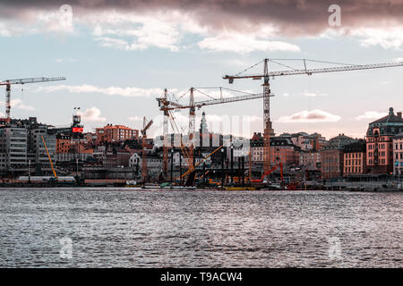 Editorial 03.26.2019 Stockholm Sweden Massive construction works with many cranes going on at Slussen at sunset Stock Photo