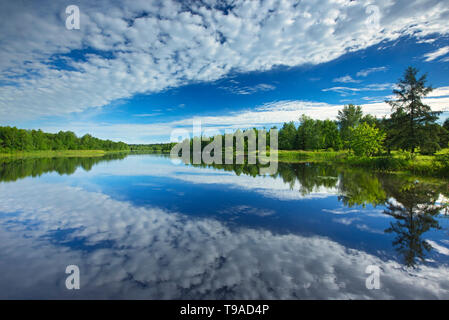 Cloud reflection on Riviere Fraser Latulipe Quebec Canada Stock Photo