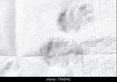 tears on white paper handkerchief close up detail, grief crying sorrow Stock Photo