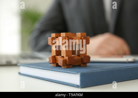 Brain teaser on table of businessman Stock Photo