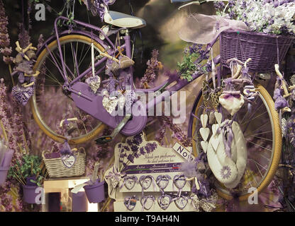 Purple bicycle hanging in a shop for decoration Stock Photo