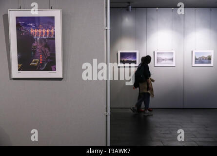 Berlin, Germany. 17th May, 2019. Visitors look at pictures displayed during Nanjing Cultural and Tourism Weeks at the China Cultural Center in Berlin, capital of Germany, on May 17, 2019. Credit: Shan Yuqi/Xinhua/Alamy Live News Stock Photo