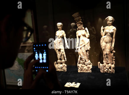 (190518) -- BEIJING, May 18, 2019 (Xinhua) -- A visitor views exhibits at an exhibition of Afghan national treasures at Tsinghua University Art Museum in Beijing, capital of China, May 17, 2019. The exhibition displayed a total of 231 pieces of the national treasures and relics from Afghanistan. China is holding a rich variety of exhibitions and activities on the culture of Asian countries and regions as well as exchanges among them. (Xinhua/Pan Xu)