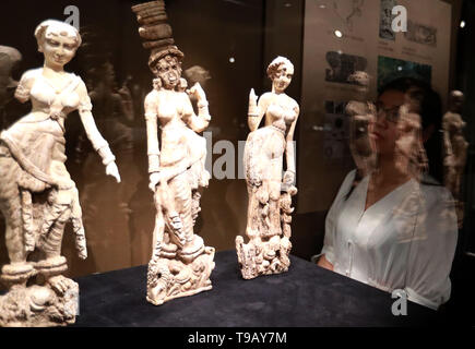 (190518) -- BEIJING, May 18, 2019 (Xinhua) -- A visitor views exhibits at an exhibition of Afghan national treasures at Tsinghua University Art Museum in Beijing, capital of China, May 17, 2019. The exhibition displayed a total of 231 pieces of the national treasures and relics from Afghanistan. China is holding a rich variety of exhibitions and activities on the culture of Asian countries and regions as well as exchanges among them. (Xinhua/Pan Xu)