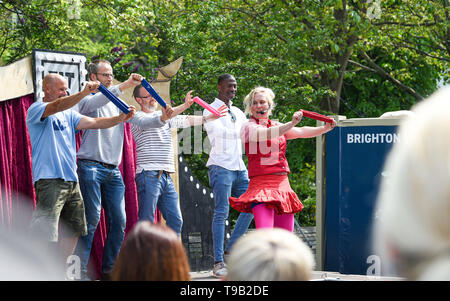 Brighton UK 18th May 2019 -  Audience participation at the Fringe City street entertainment which is part of the Brighton Festival 2019 . Credit : Simon Dack / Alamy Live News Stock Photo