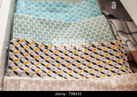 Clean kitchen towels in drawer Stock Photo