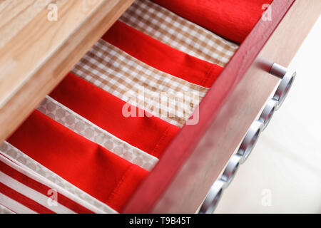 Clean kitchen towels in drawer Stock Photo