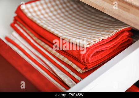 Clean kitchen towels in drawer Stock Photo