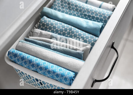 Clean kitchen towels in drawer Stock Photo