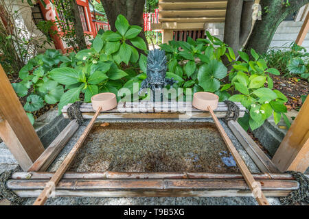 Tokyo - August 14, 2018 : Chozuya or Temizuya (Water Ablution Pavilion) at Sanno Inari Jinja sub-shrine of Hie Jinja. Shinto shrine located in Akasaka Stock Photo