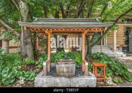 Tokyo - August 14, 2018 : Chozuya or Temizuya (Water Ablution Pavilion) at Sanno Inari Jinja sub-shrine of Hie Jinja. Shinto shrine located in Akasaka Stock Photo