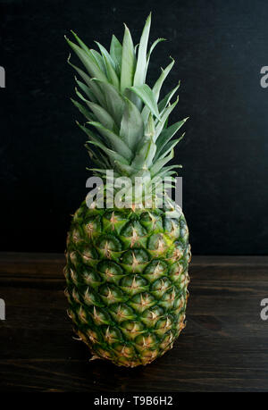 Whole Pineapple on a Dark Background Stock Photo