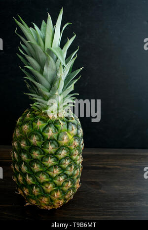 Whole Pineapple on a Dark Background Stock Photo