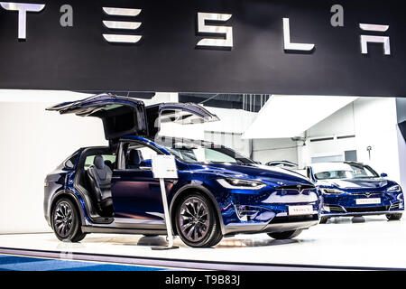 Brussels, Belgium, Jan 21, 2019: metallic blue Tesla Model X P100D at Brussels Motor Show, electric vehicle EV SUV produced by Tesla, Stock Photo