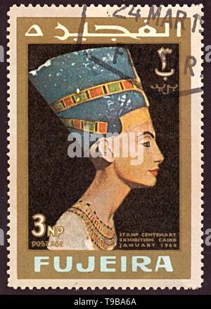 FUJEIRA - CIRCA 1966: stamp printed by Fujeira, shows Head staue of egyptian queen Nefertiti. centenary exibition Cairo Egypt january 1966. circa 1966 Stock Photo