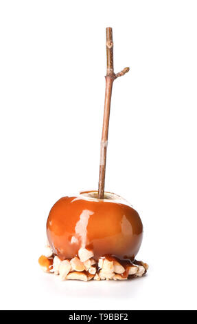 Delicious caramel apple with tree branch on white background Stock Photo