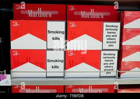 Cigarettes sold in bulk at an airport duty free, showing a 