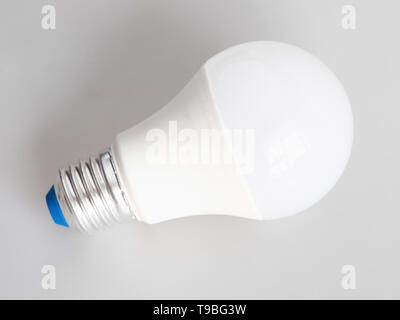 energy-saving household LED bulb light on gray background Stock Photo