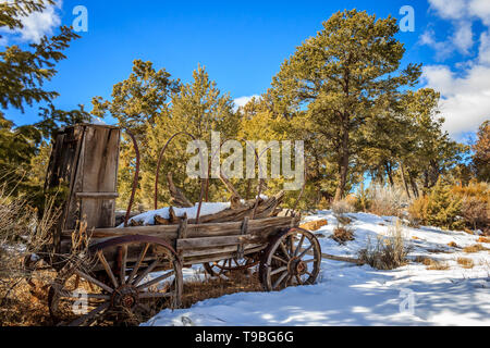 A historic wagon rests in the snow at Mesa Verde National Park, Colorado, USA Stock Photo