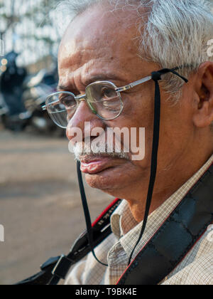 31 Mar 2019 senior citizen photographer waiting out side of mahakali cave mumbai maharashtra INDIA Stock Photo