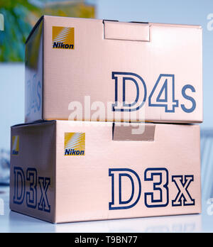 Paris, France - Feb 28, 2017: Cardboard boxes packs with new professional Nikon D3X DSLR and D4s cameras new professional equipment for photo studio  Stock Photo