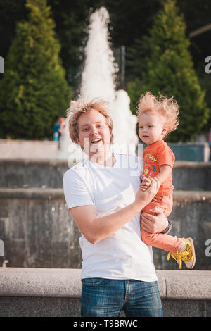 Happy father with his little son in park Stock Photo