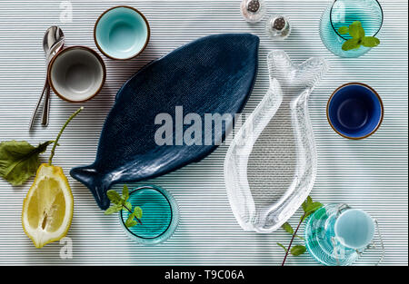 empty fish-shaped plates on a festive served table Stock Photo